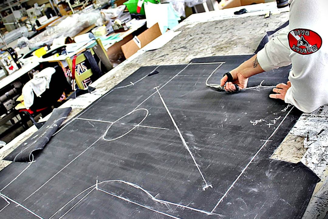 Cutting the material on the sewing pattern